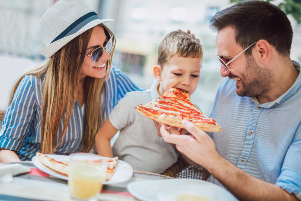 Family dining near Highlander Apartments in Fayetteville, North Carolina