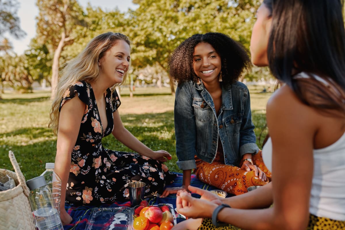 Friends having a picnic at a local park in Tyler, Texas from Marquis at The Cascades