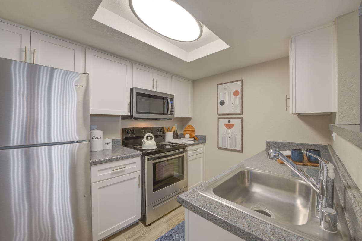 Stainless-steel appliances in an apartmetn kitchen at Ardella on Chagall in Moreno Valley, California