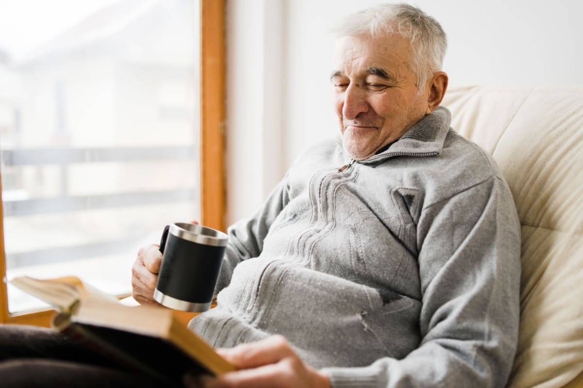 A resident using a smart phone at The Oxford Grand Assisted Living & Memory Care in Kansas City, Missouri