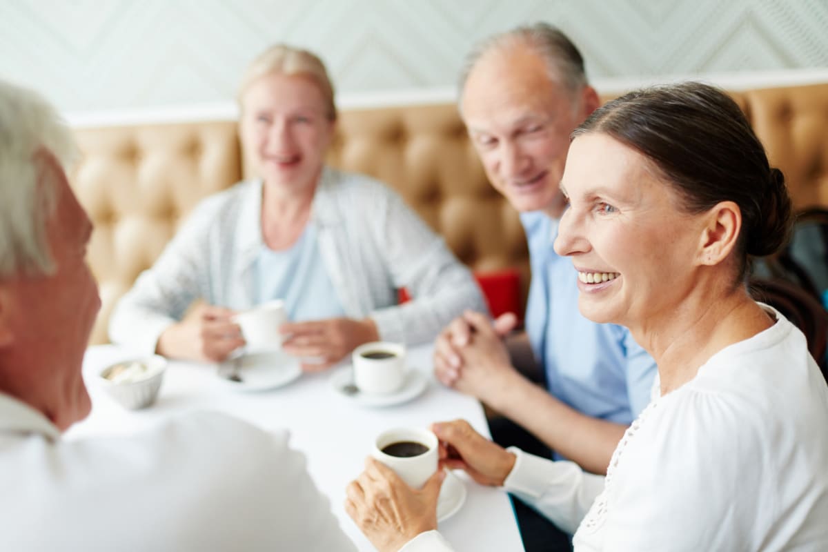 Residents enjoying coffee together at an Oxford Senior Living location