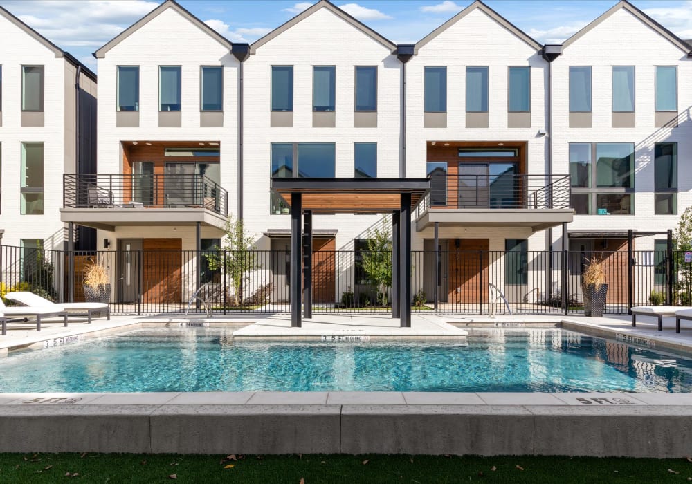 Exterior of Knox/Henderson and luxurious swimming pool at The Collection Townhomes in Dallas, Texas