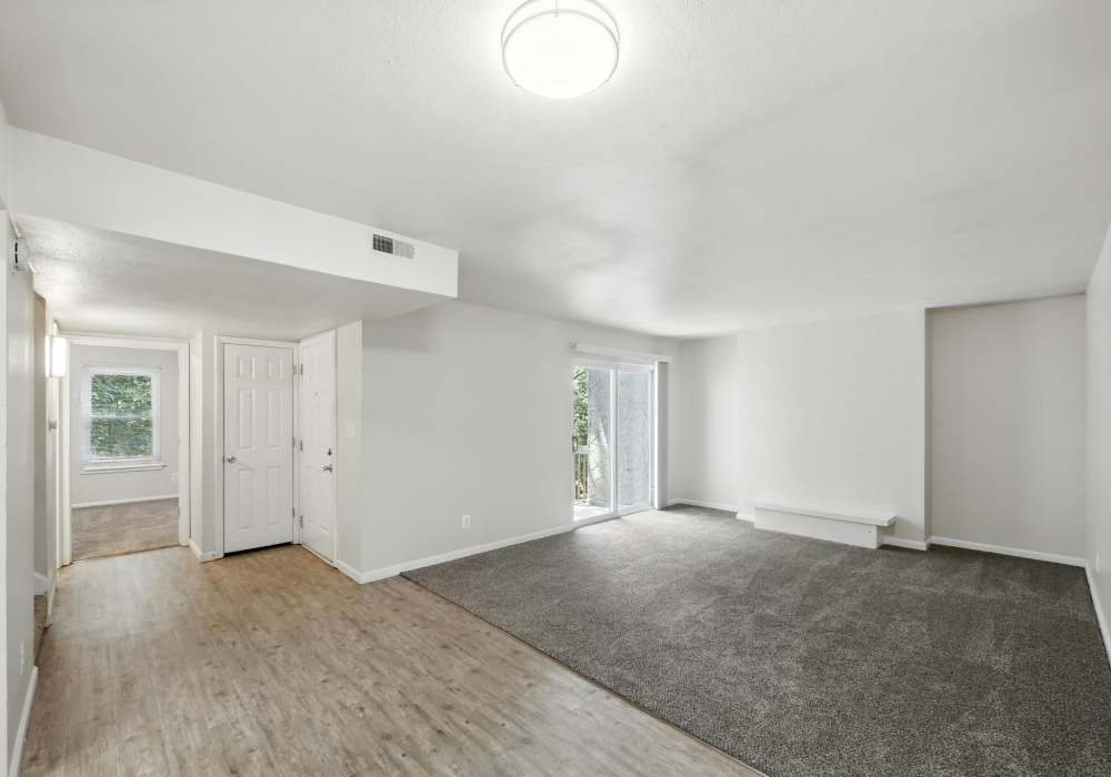 Living room with wooden flooring and vaulted ceilings at North River Landing in Elkhart, Indiana
