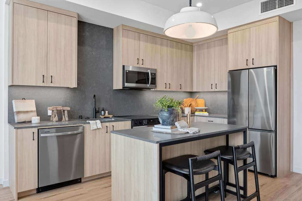 Kitchen with an island and stainless-steel appliances at Haven and Arrow in Rancho Cucamonga, California