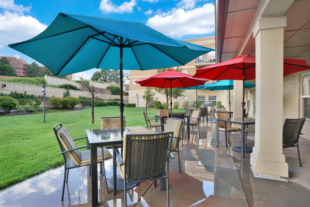 Umbrella covered outdoor seating at The Inn at Greenwood Village in Greenwood Village, Colorado