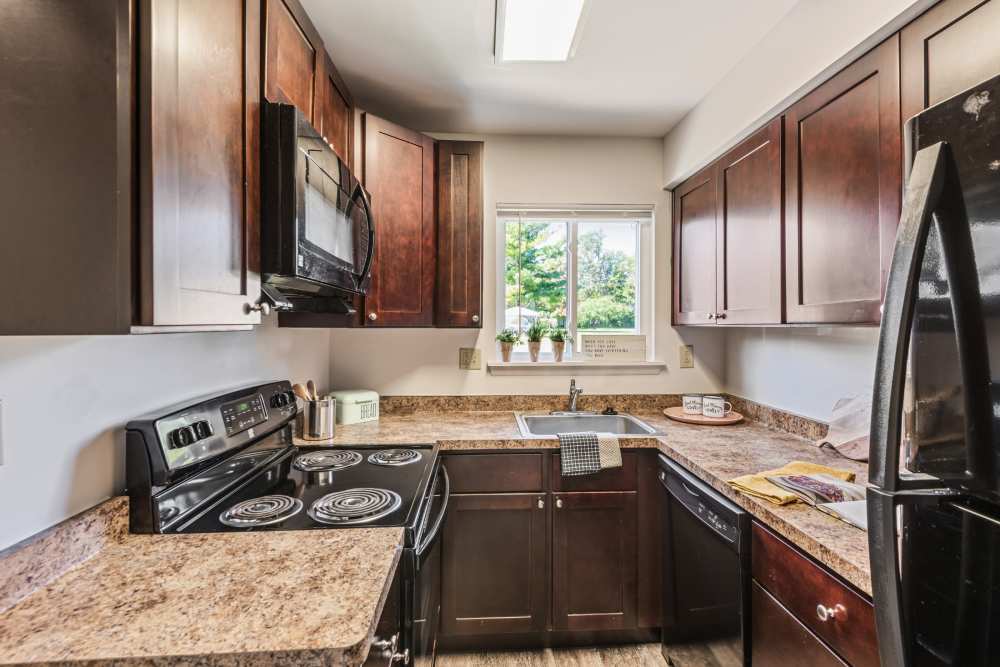 Fully equipped kitchen in a home at Penbrooke Meadows in Penfield, New York.