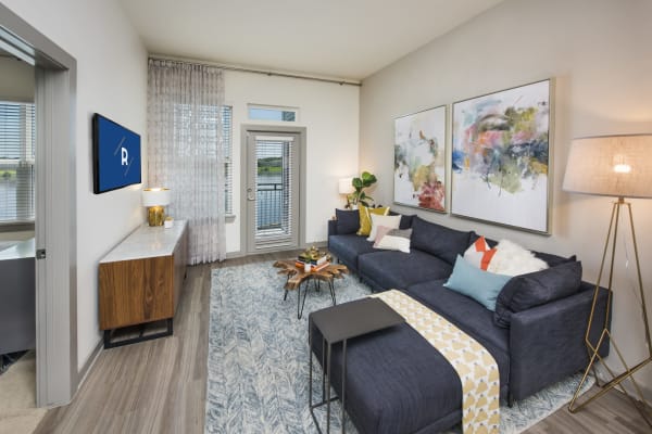 A comfortable, furnished apartment living room at Ravella at Town Center in Jacksonville, Florida