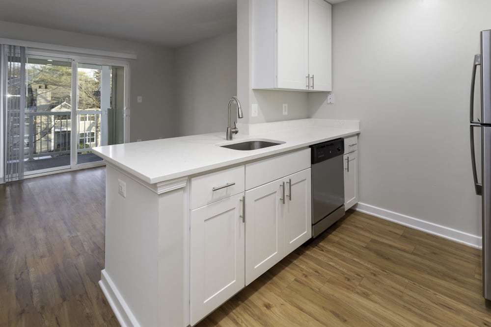 An apartment kitchen and dining room at Windsor Park in Woodbridge, Virginia