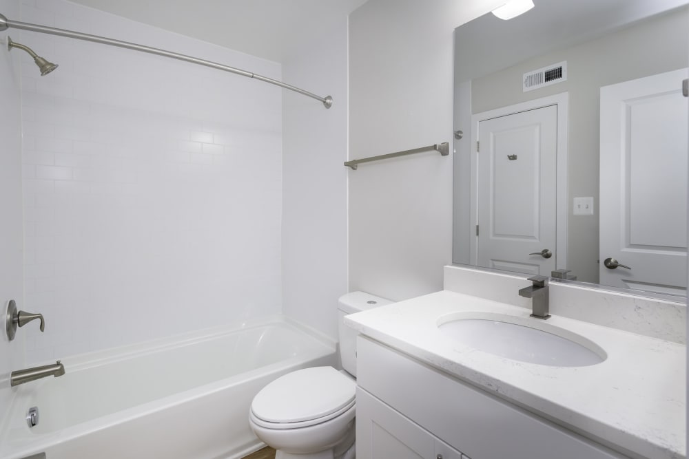 An apartment bathroom with a bathtub at Windsor Park in Woodbridge, Virginia