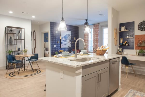 A comfortable, furnished apartment kitchen and dining room at Foundry Yards in Birmingham, Alabama