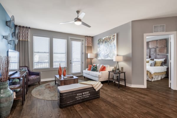 A comfortable, furnished apartment living room and bedroom at Liberty Mill in Germantown, Maryland