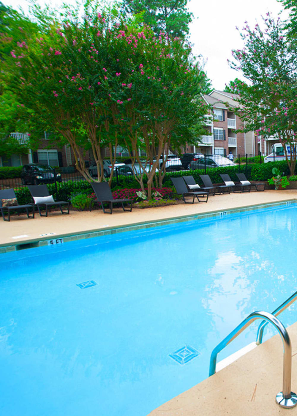 Sparkling swimming pool and sun deck at Castlegate Collier Hills in Atlanta, Georgia