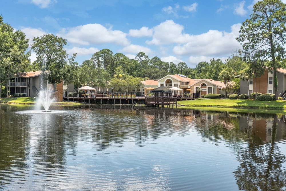 Exterior view of complex on the water at The Vue at Baymeadows Apartment Homes in Jacksonville, Florida