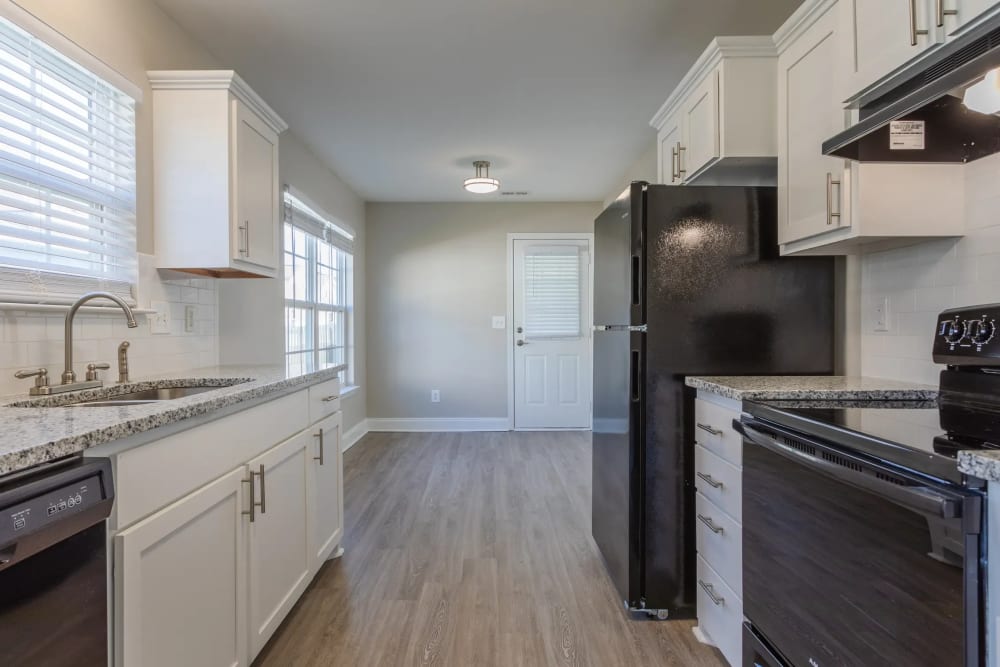 Combined view of kitchen and living room at Avalon II Apartments in Charleston, South Carolina