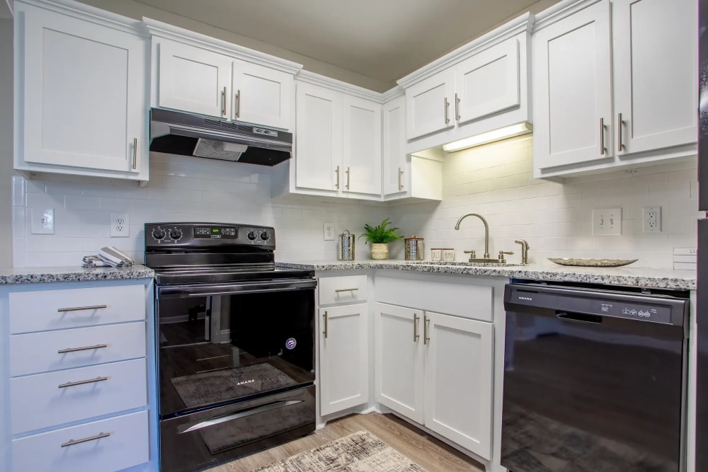 Spacious kitchen with black appliances at Avalon II Apartments in Charleston, South Carolina