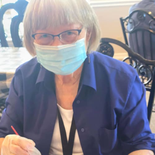 A resident painting a mug at Canoe Brook Assisted Living in Ardmore, Oklahoma
