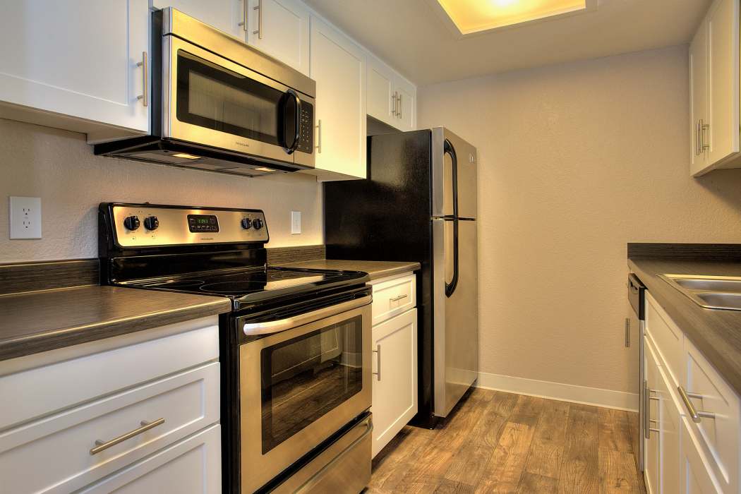 Spacious well-lit kitchen with all appliances at Sandpiper Village Apartment Homes in Vacaville, California