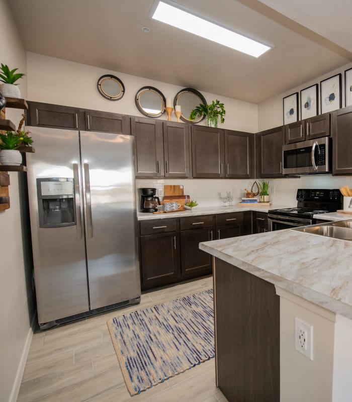 Kitchen with granite countertops at Center 301 Apartments in Belton, Missouri