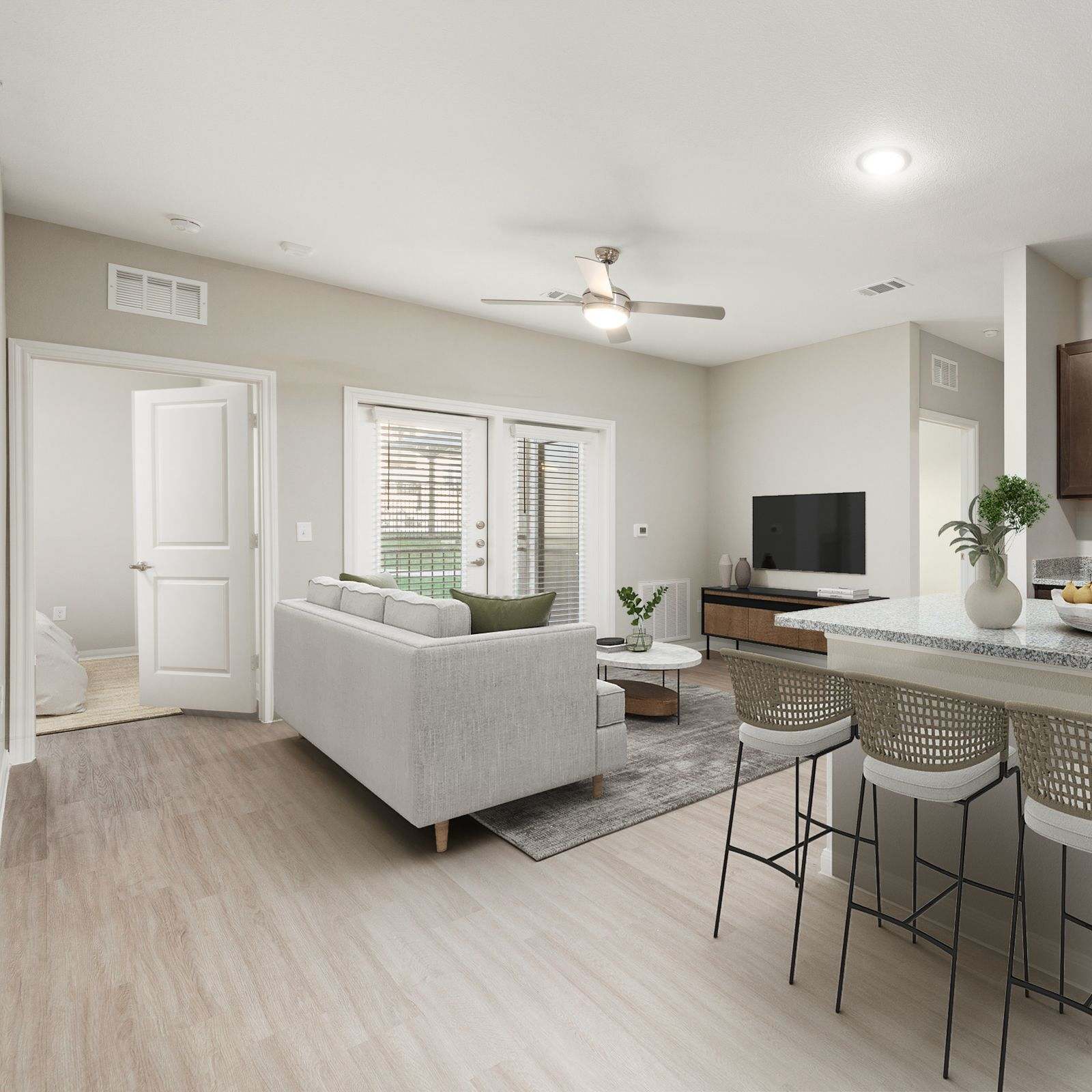 Modern living room with access to kitchen at Walnut Springs in Seguin, Texas
