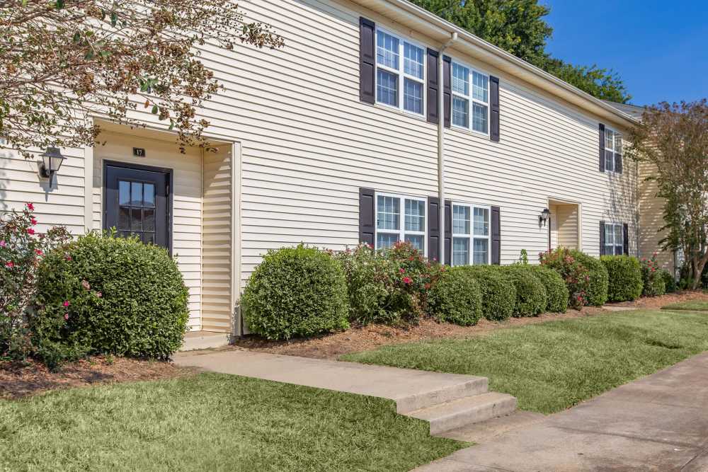 Exterior view of the apartment showing walkway at Village at Town Park in Hampton, Virginia