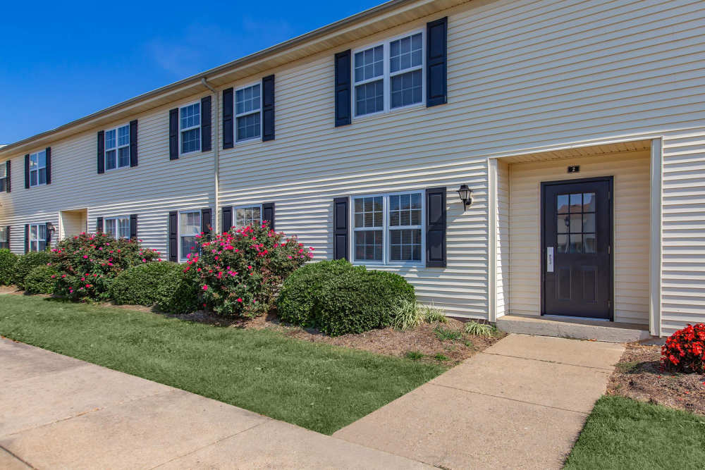 A wide exterior view of the apartment building at Village at Town Park in Hampton, Virginia