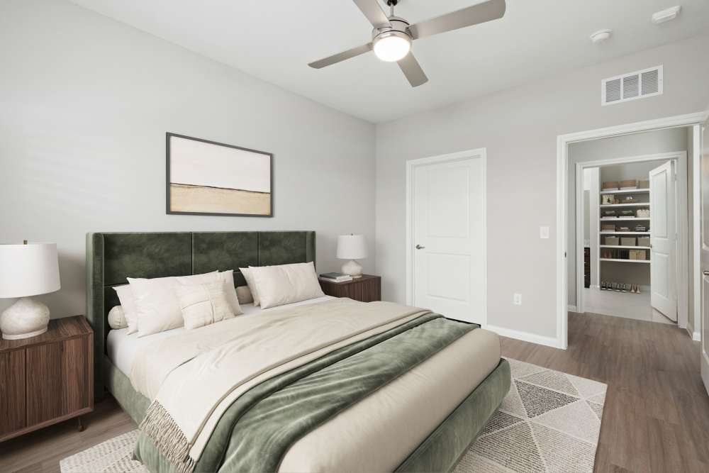 Cozy bedroom with a ceiling fan at The Janson in Del Valle, Texas