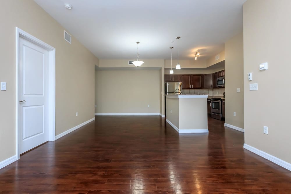 Living room with view of kitchen island at Adagio at Westshore Palms in Tampa, Florida