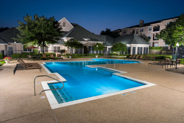 Night picture at one of the two pools at Ballantyne Apartments