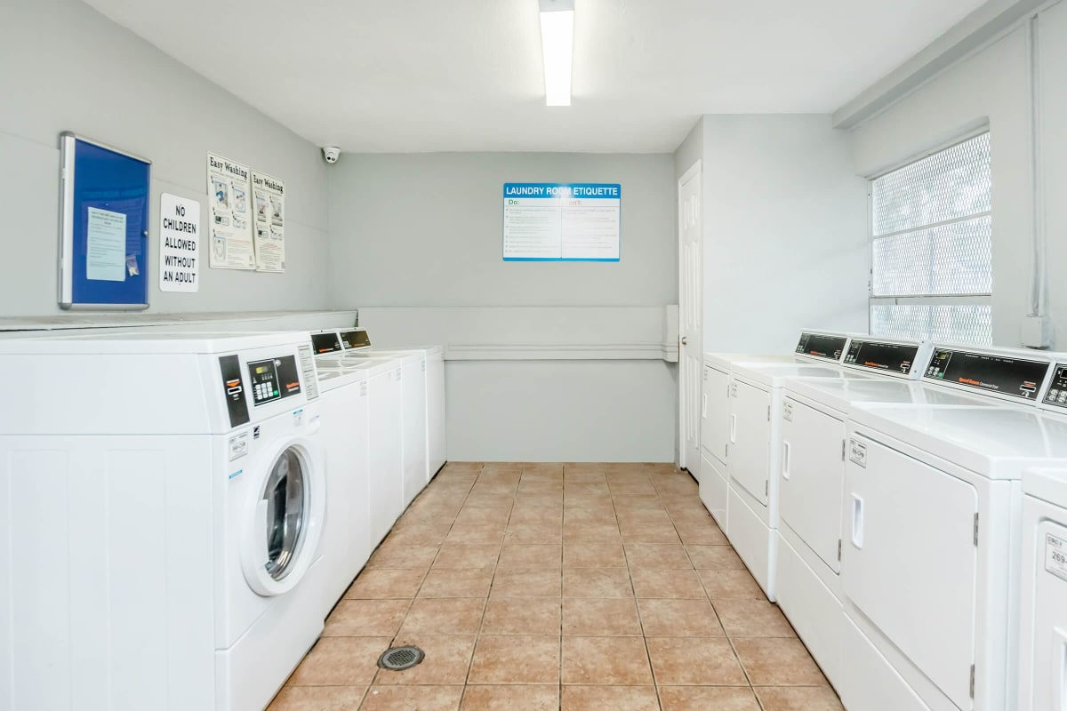 View amenities like our laundry facility at Magnolia Court in Orlando, Florida