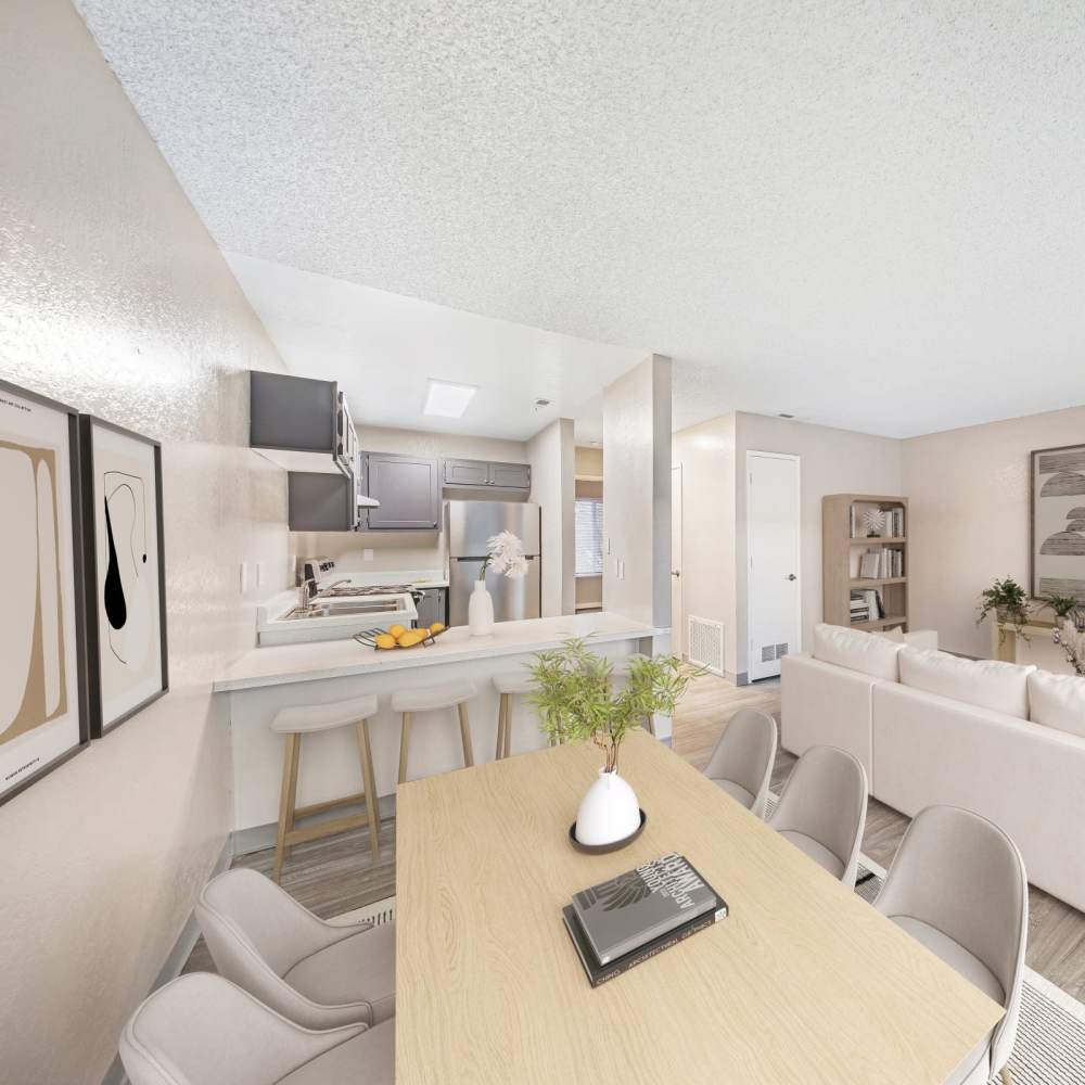 Bright open-plan living room with a dining area in the foreground and classy white tone furniture at Kirman Garden in Reno, Nevada