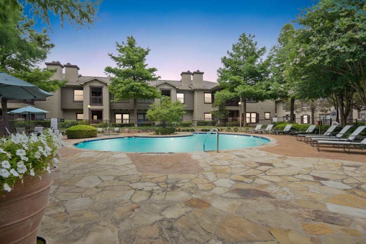 Plenty of poolside lounge chairs outside at Ranch ThreeOFive in Arlington, Texas