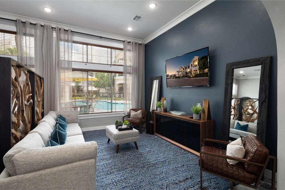 Clubhouse next to the pool with tons of amenities for guests to enjoy with their friends at The Retreat at Cinco Ranch in Katy, Texas
