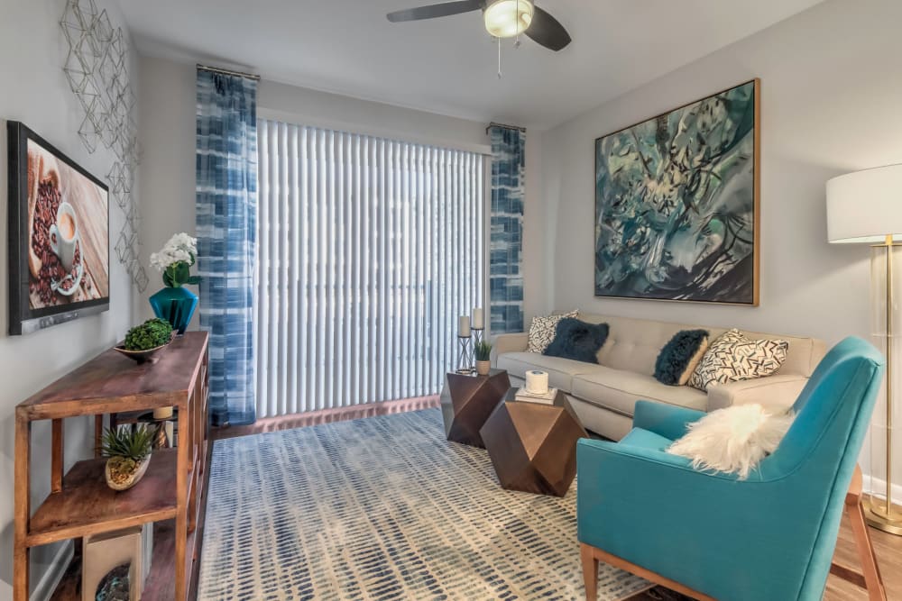 Ceiling fan and modern decor in a model home's living area at The Palmer in Charlotte, North Carolina