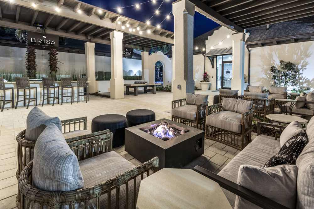 Outdoor seating area with fire pits and sofas at Brisa at St. Augustine in St. Augustine, Florida