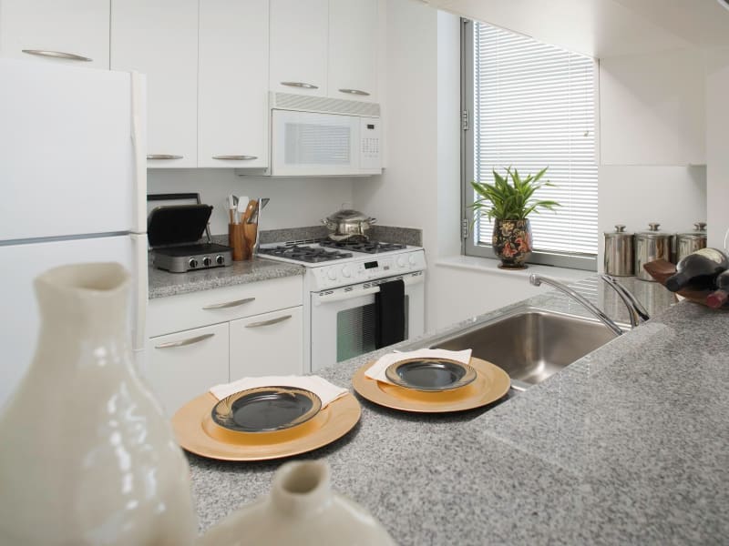 A beautiful kitchen with white appliances at The Metropolis in New York, New York