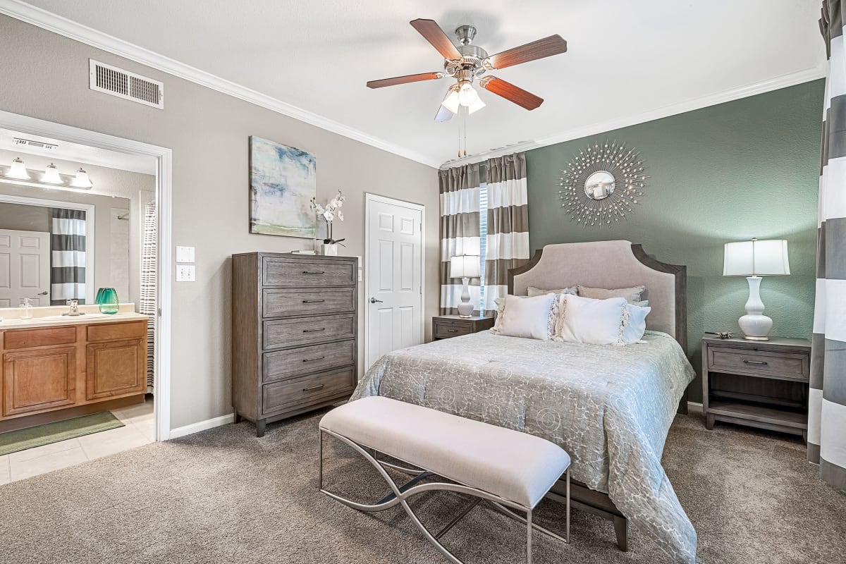 Modern style bedroom with multiple windows at Marquis at The Cascades in Tyler, Texas
