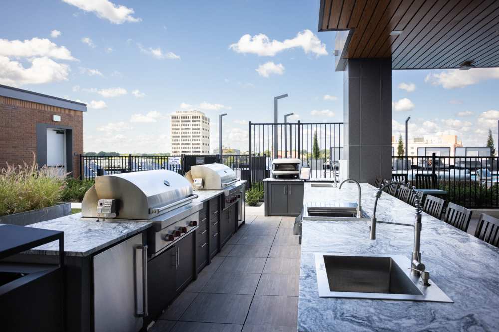 Outdoor grilling area at The Novus Apartments in Durham, North Carolina