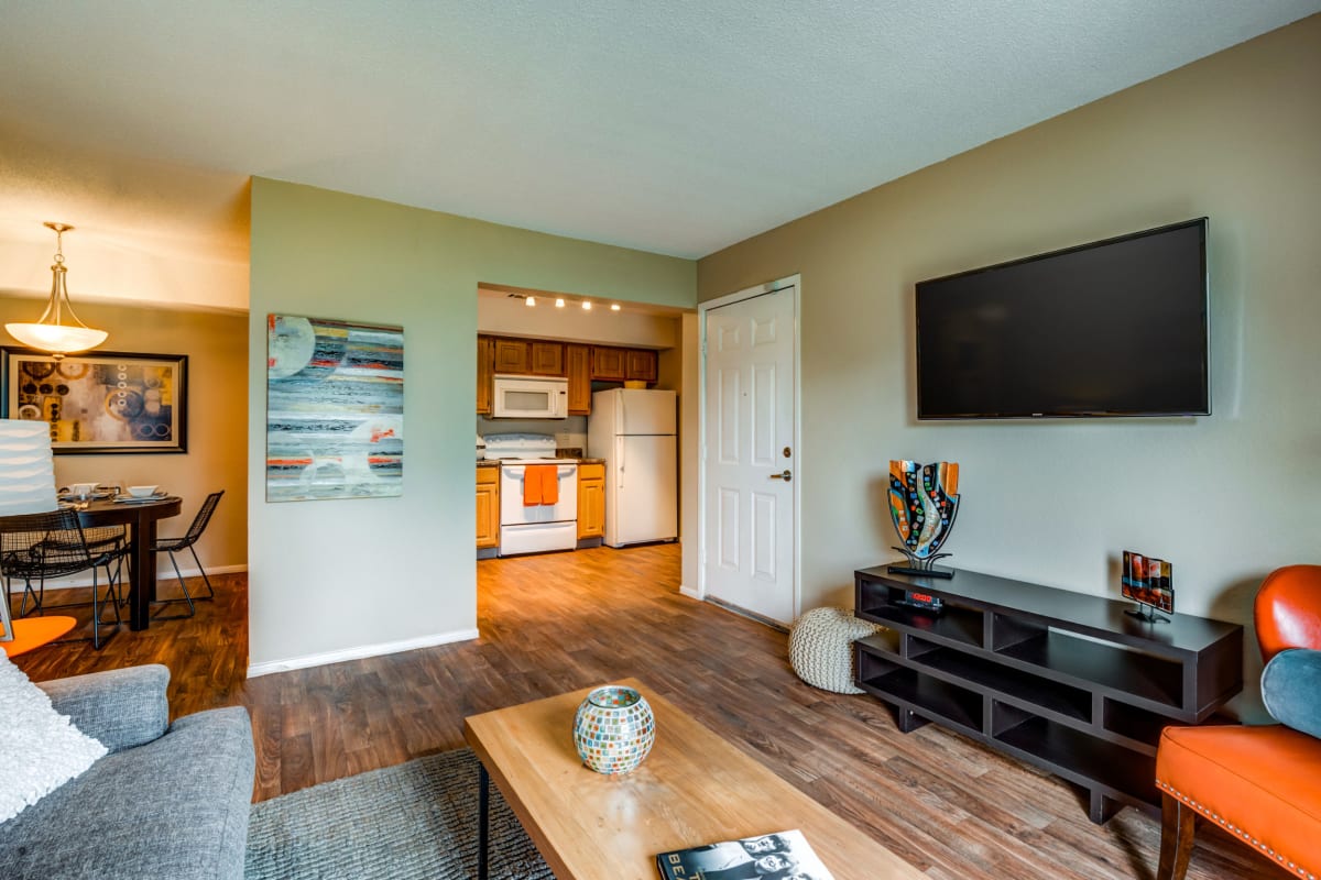Wood-style flooring in an apartment living room at Arlo of Olathe in Olathe, Kansas