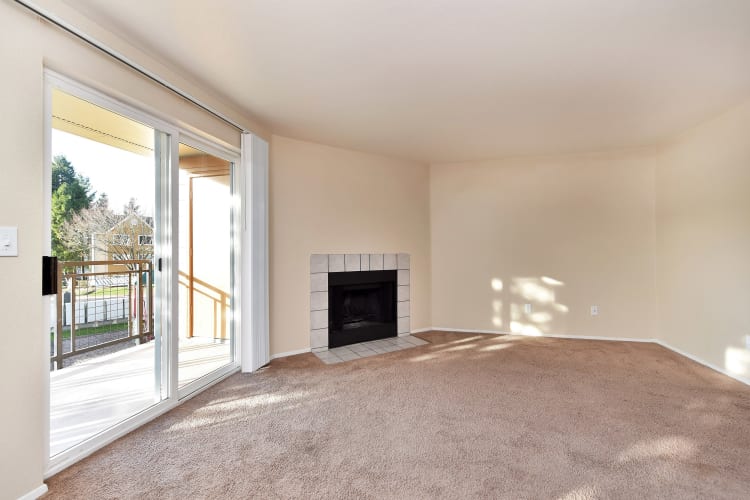 Open living room space with fireplace at Preserve at Sunnyside Apartments