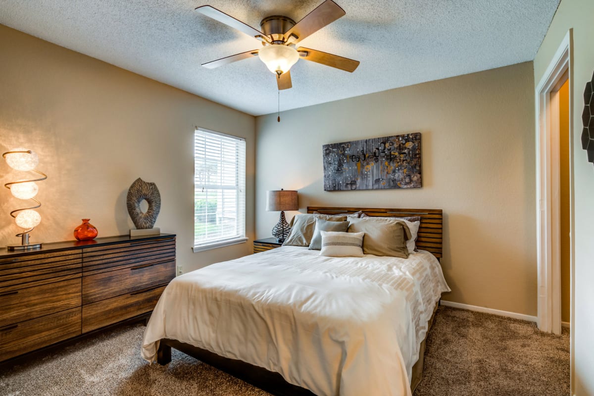 Bedroom with a ceiling fan at Arlo of Olathe in Olathe, Kansas