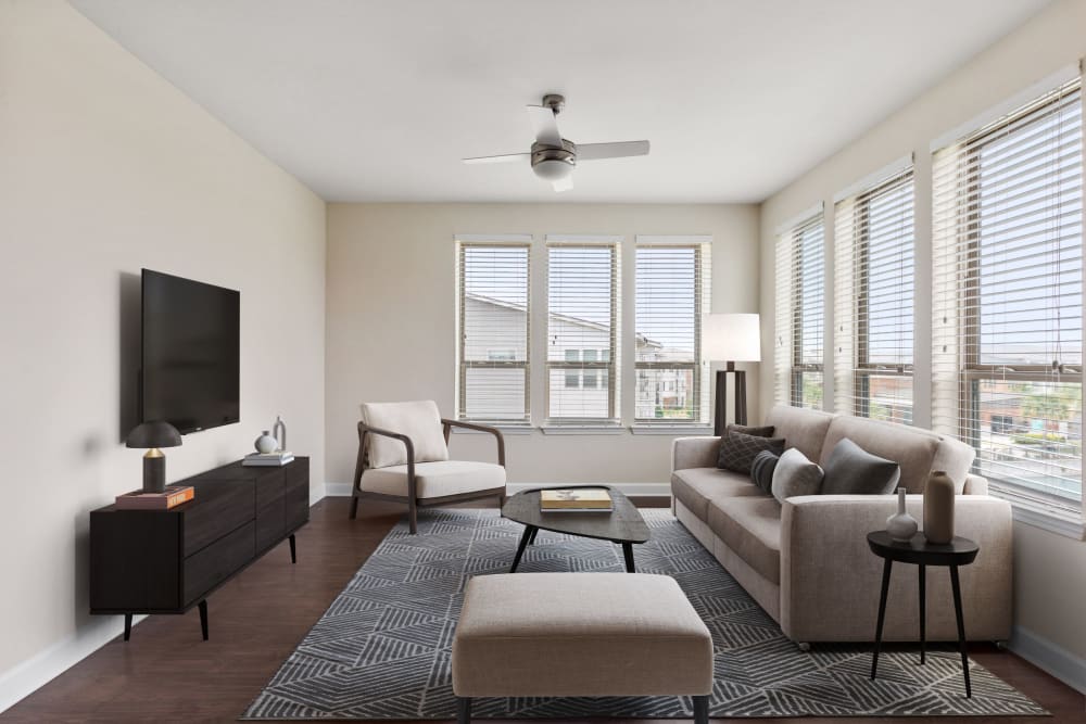 Living room and kitchen in a model apartment home at The Point at Town Center in Jacksonville, Florida