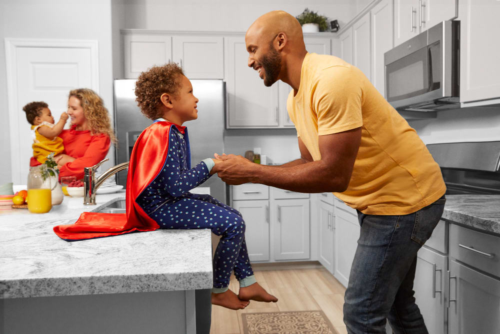 A family in the kitchen at BB Living at Civic Square in Goodyear, Arizona