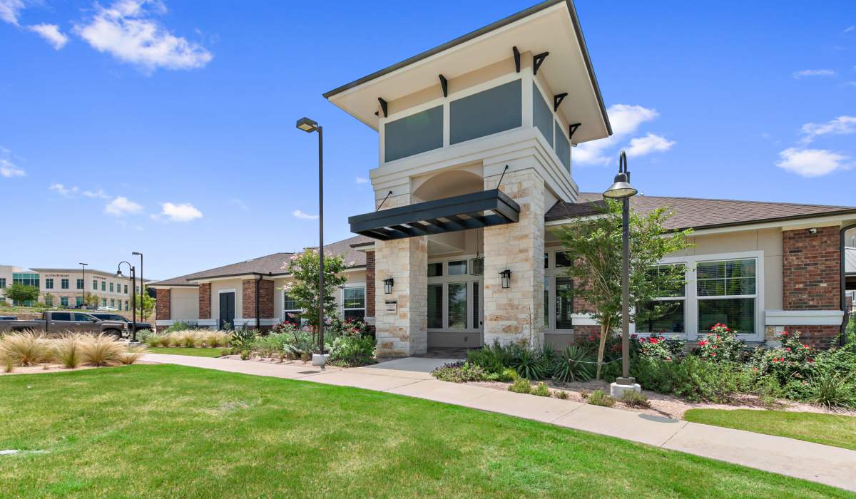 Green lawn outside of leasing office at Sadler House in San Marcos, Texas