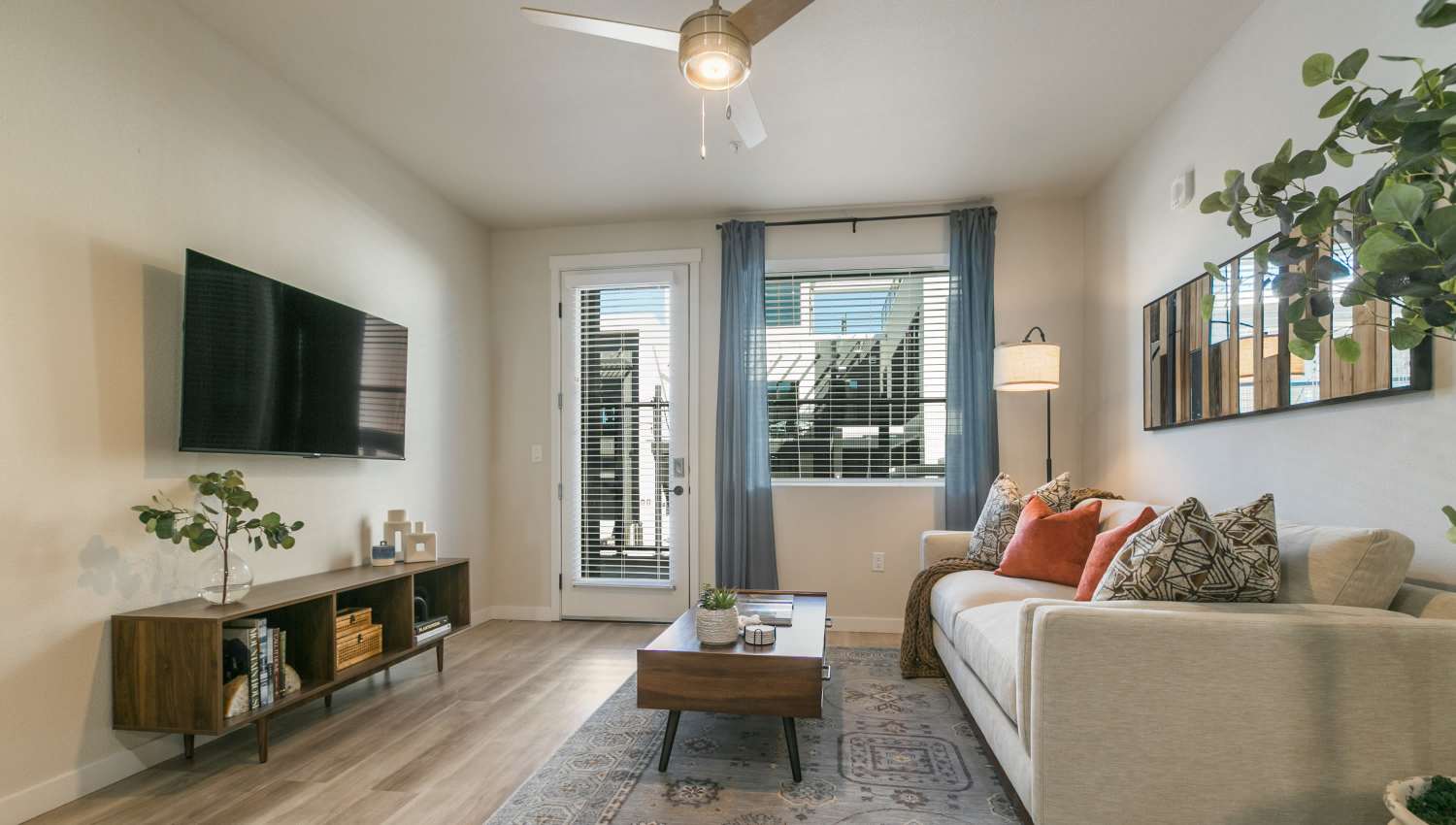 Living room with tv at Olympus Latitude in Albuquerque, New Mexico
