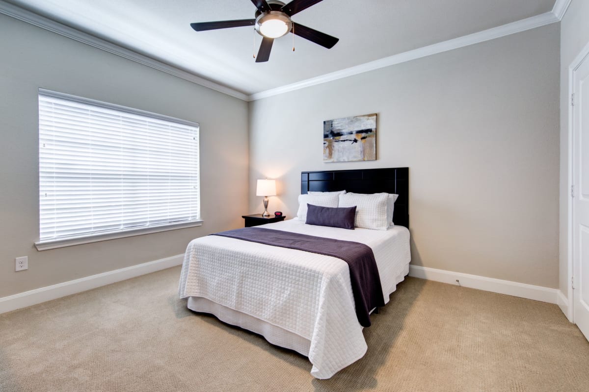Bedroom with carpet flooring at Marquis on Memorial in Houston, Texas
