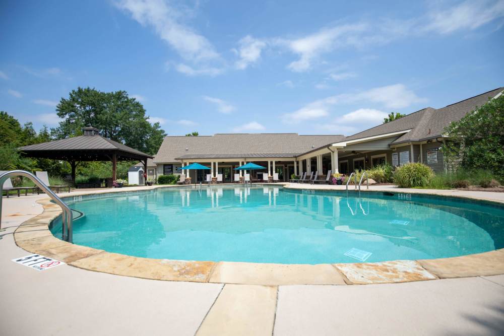 Resort-style swimming pool with sundeck at Ballantyne Commons of Augusta in Augusta, Georgia