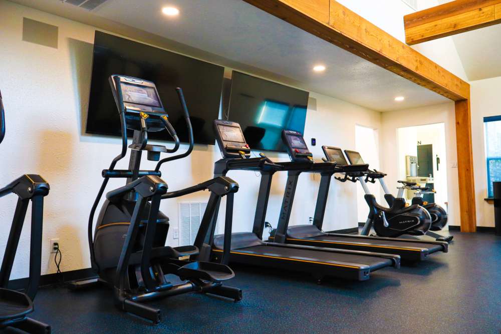 Fitness center with cardio at Savannah Square & Savannah Harbor in Norman, Oklahoma