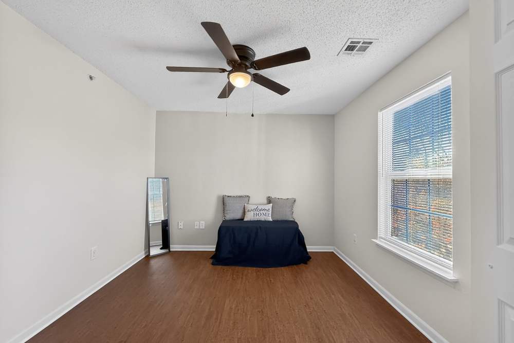 Bedroom with ceiling fan at Lakeside in Mt Pleasant, Texas