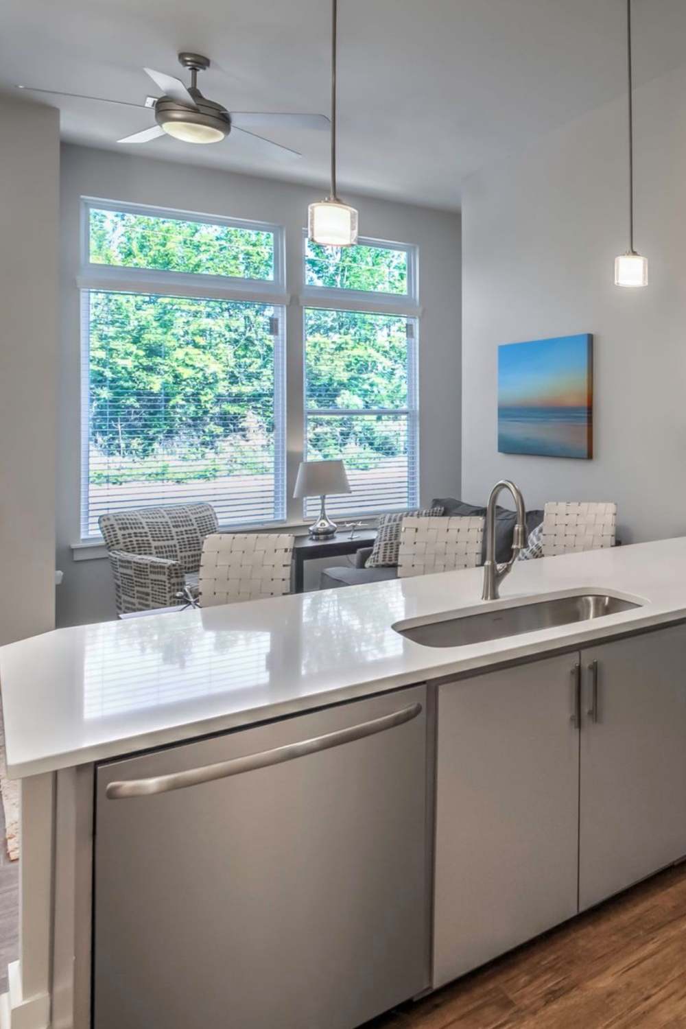 Luxury community kitchen connected to living room at 300 Optimist Park in Charlotte, North Carolina