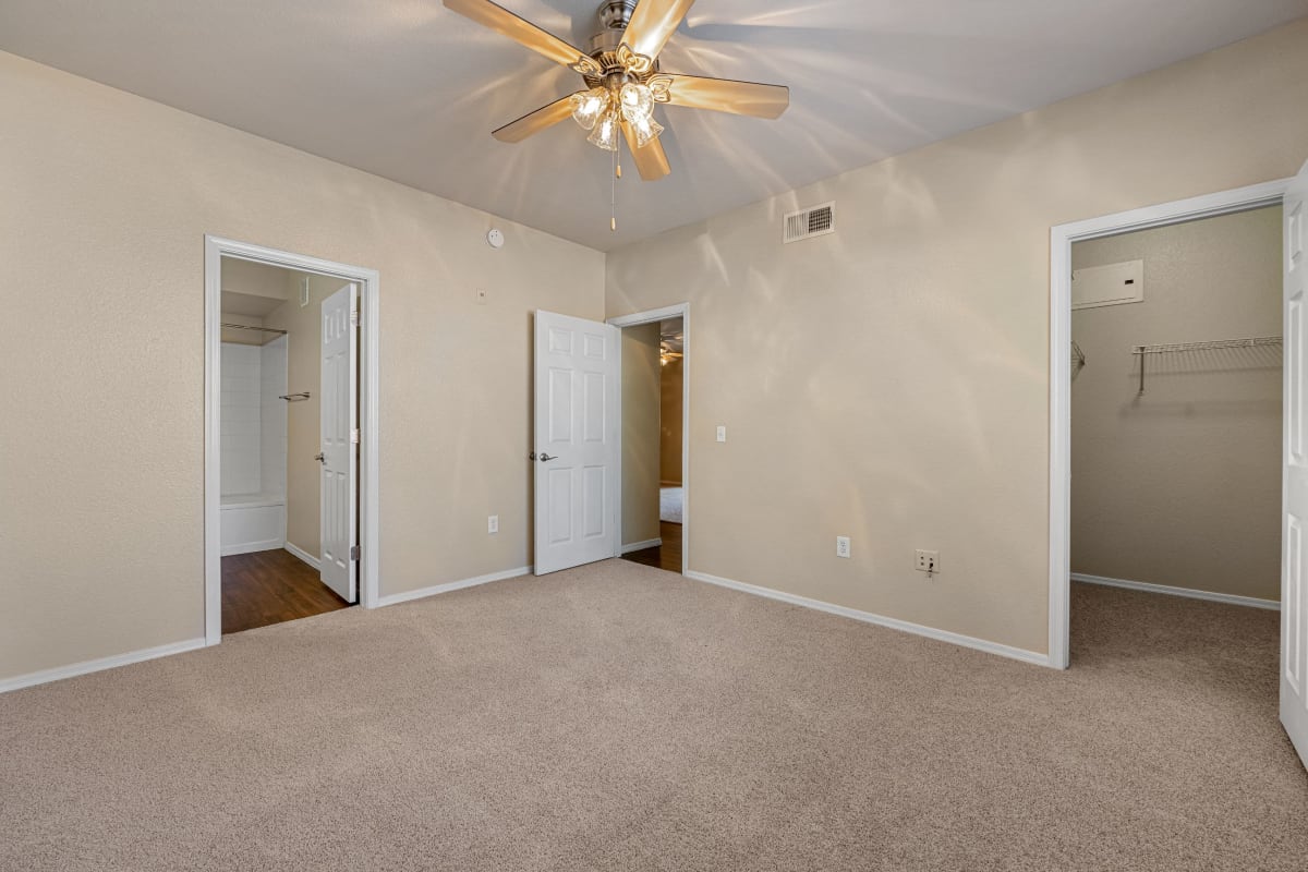 Bright bedroom with a walk in closet at Azure Creek in Cave Creek, Arizona
